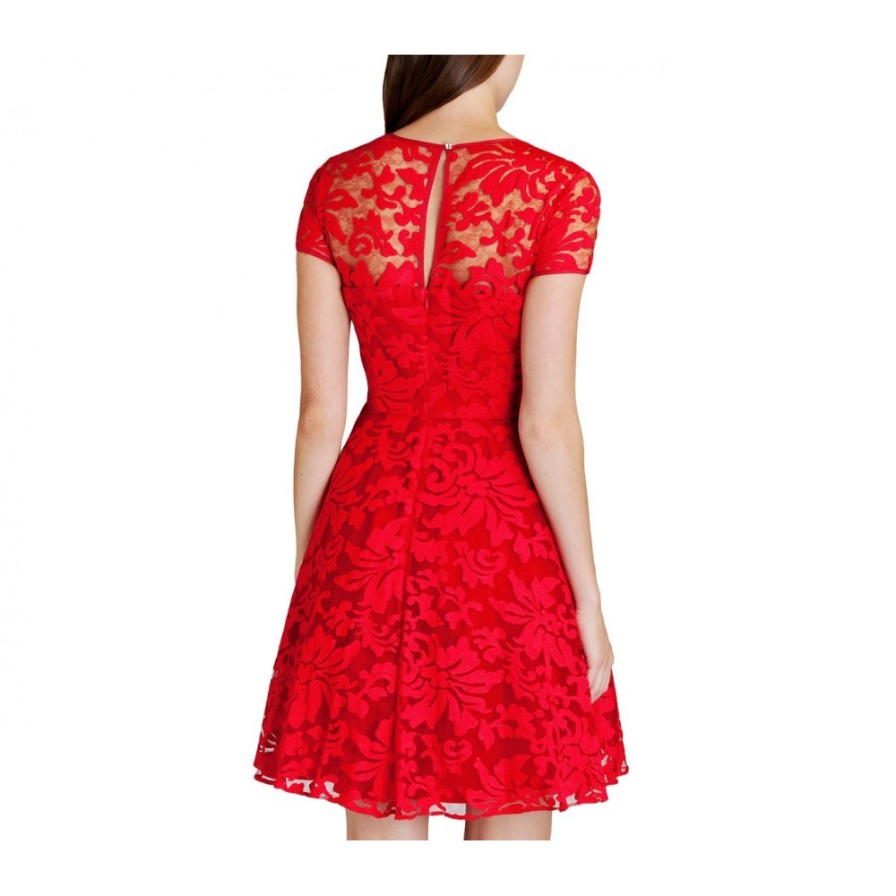 Robe dentelle manches courtes bouton sur le dos.Légèrement évasée et  tendance